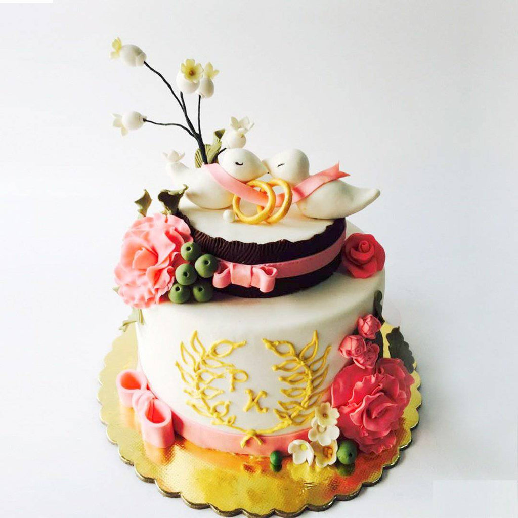 Floral With Rings Decorated Cake