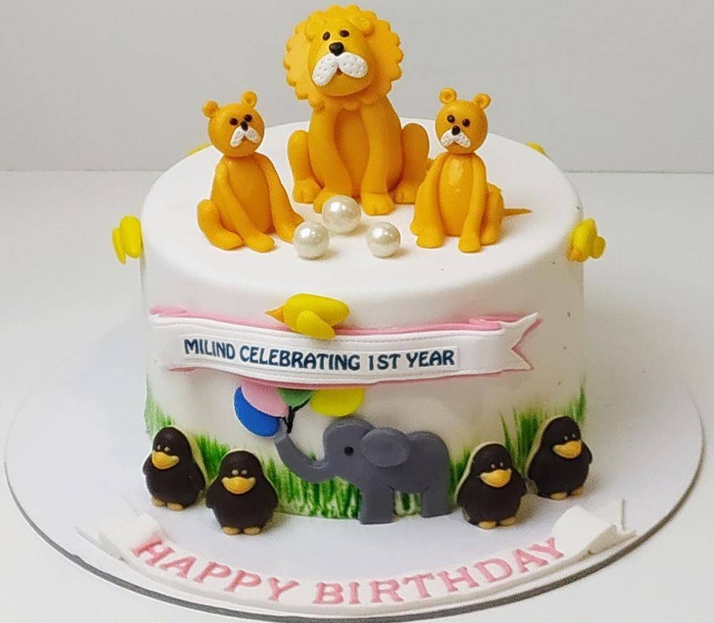 Lion And Penguin Theme Cake